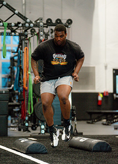 a man running in a gym